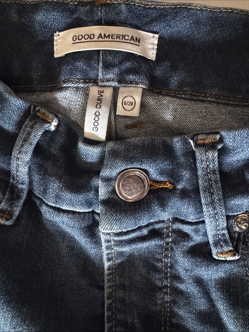 Good American Blue High-Rise Jeans. Good curve style.